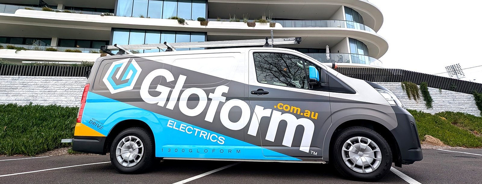Gloform Electrics van parked outside an apartment building in Melbourne